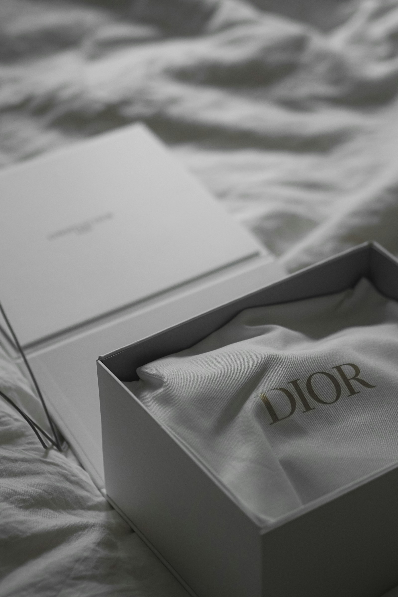 Dior cloth packaging inside an open gift box